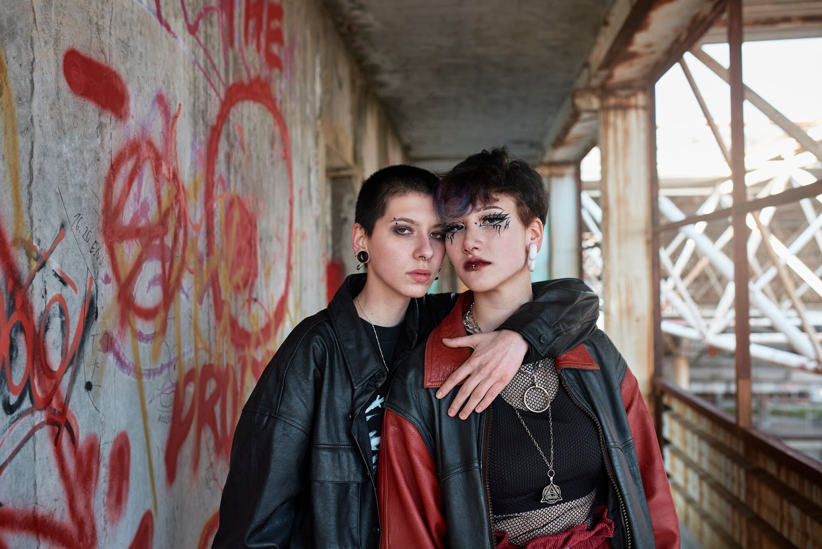 Alternative fashion photography of two models in a building