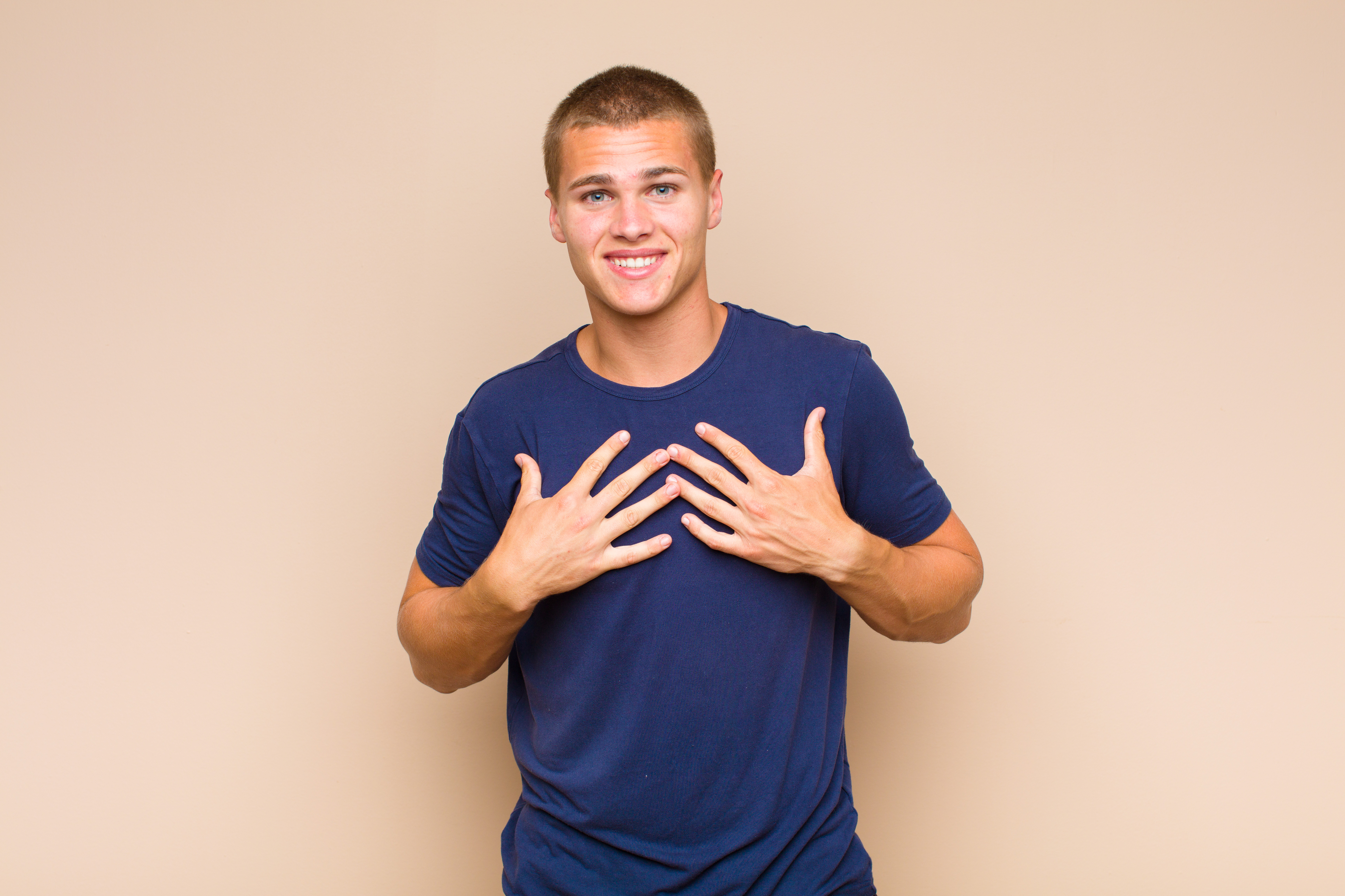 Smiling man placing hands thoughtfully