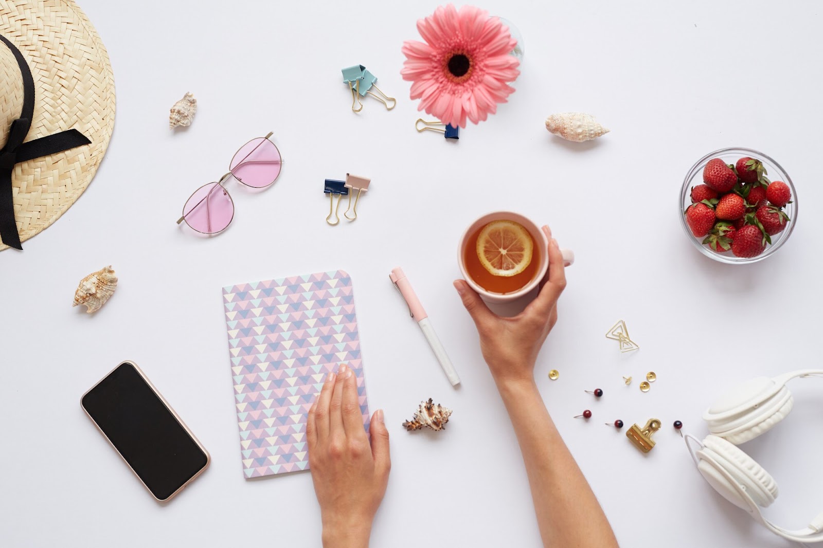 A person holding a cup for flat lay photoshoot