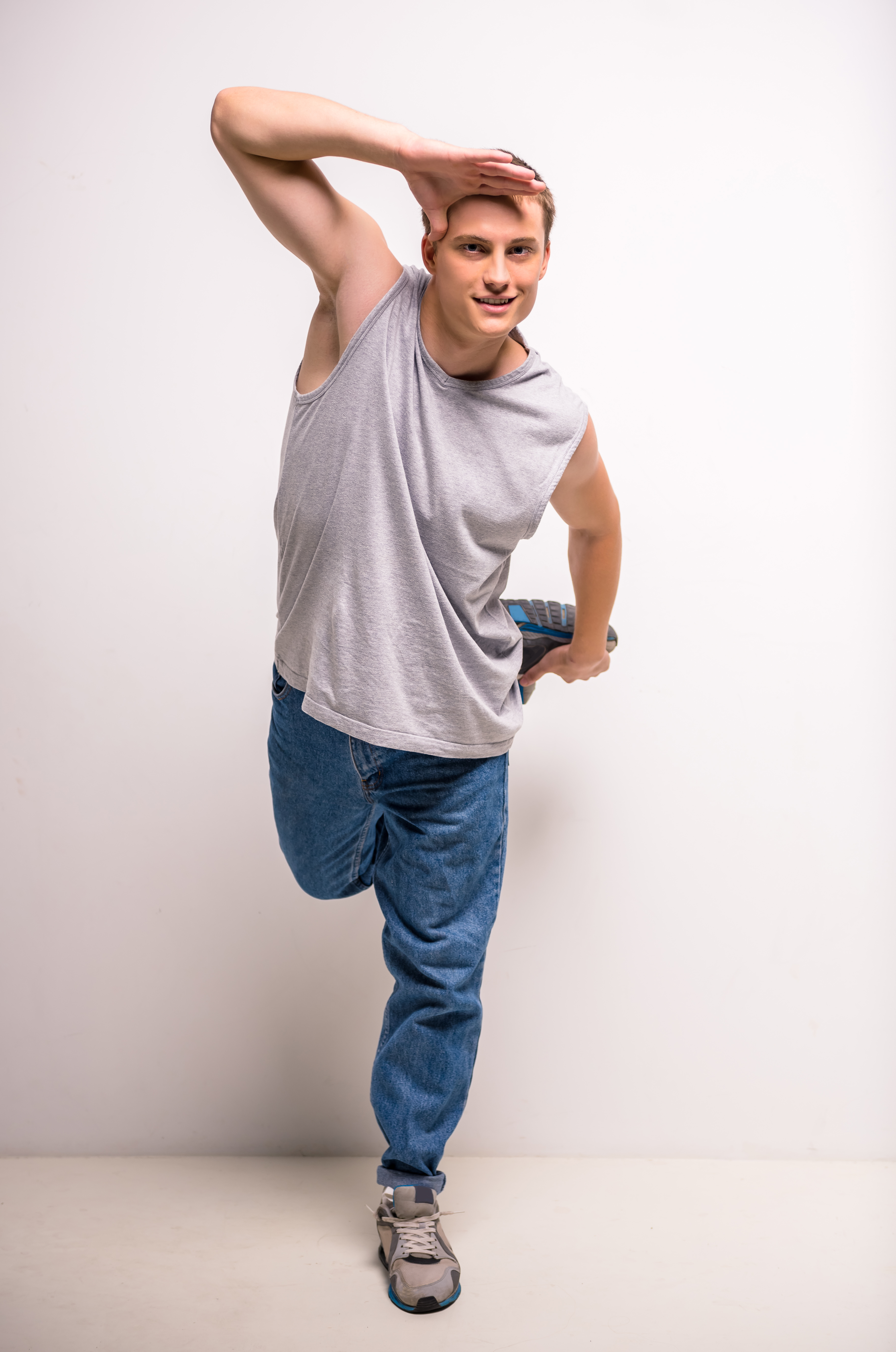 Man stretching leg while balancing