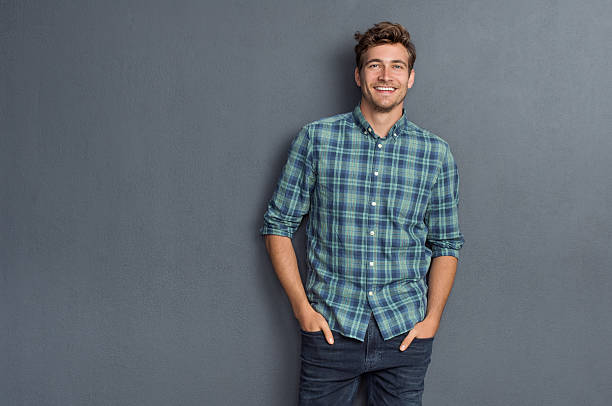 Relaxed man smiling in plaid shirt