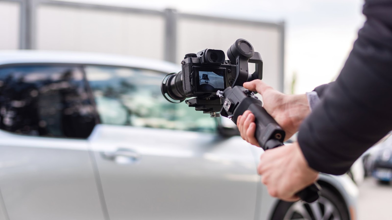  Photographer taking photos of a car