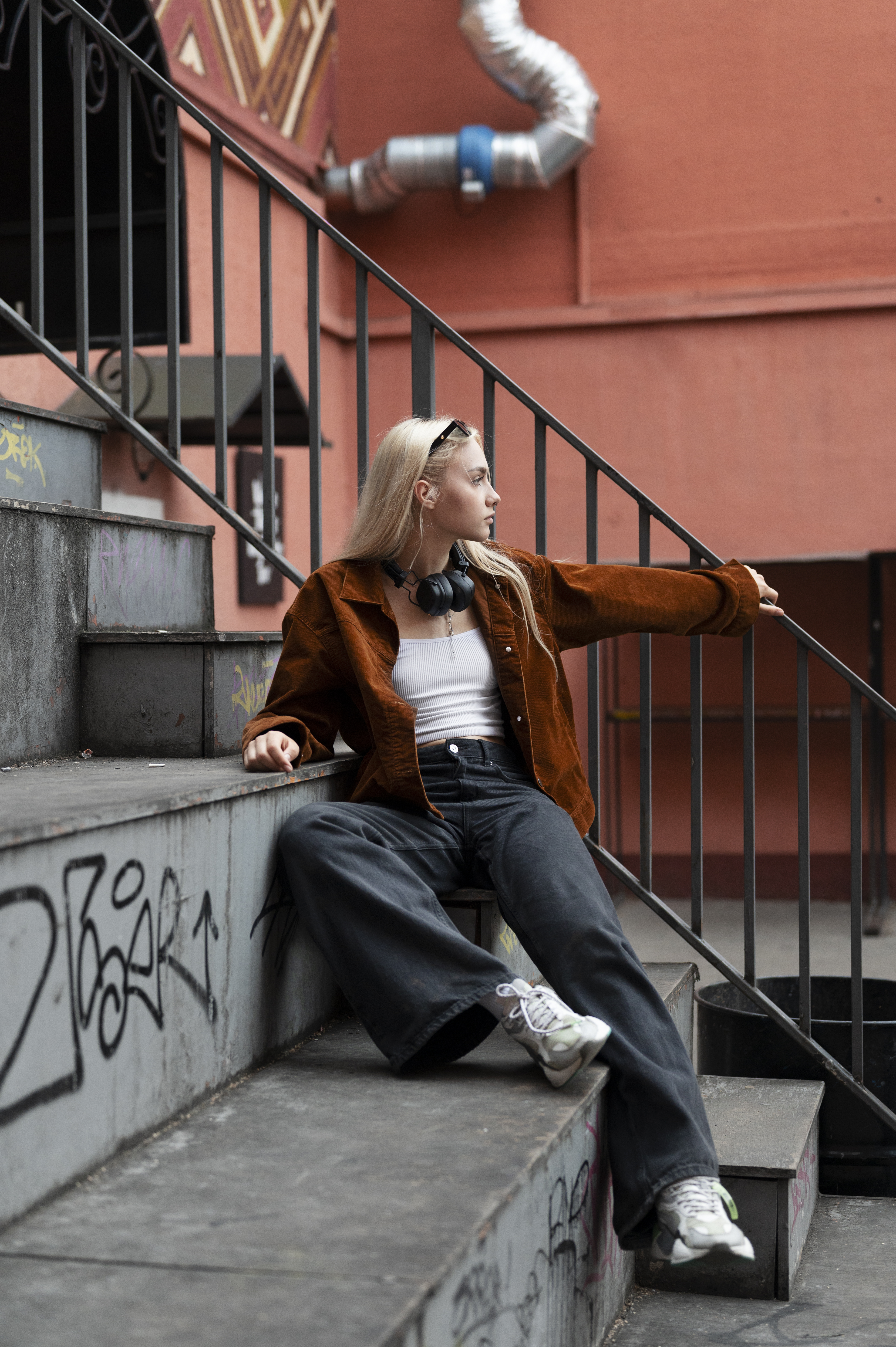 A model posing in an urban setting