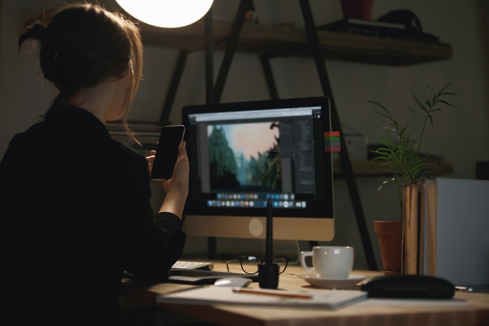 Designer editing on the computer in the cozy workspace