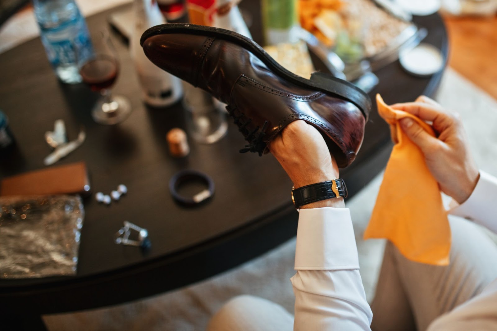 Man cleaning his leather shoes