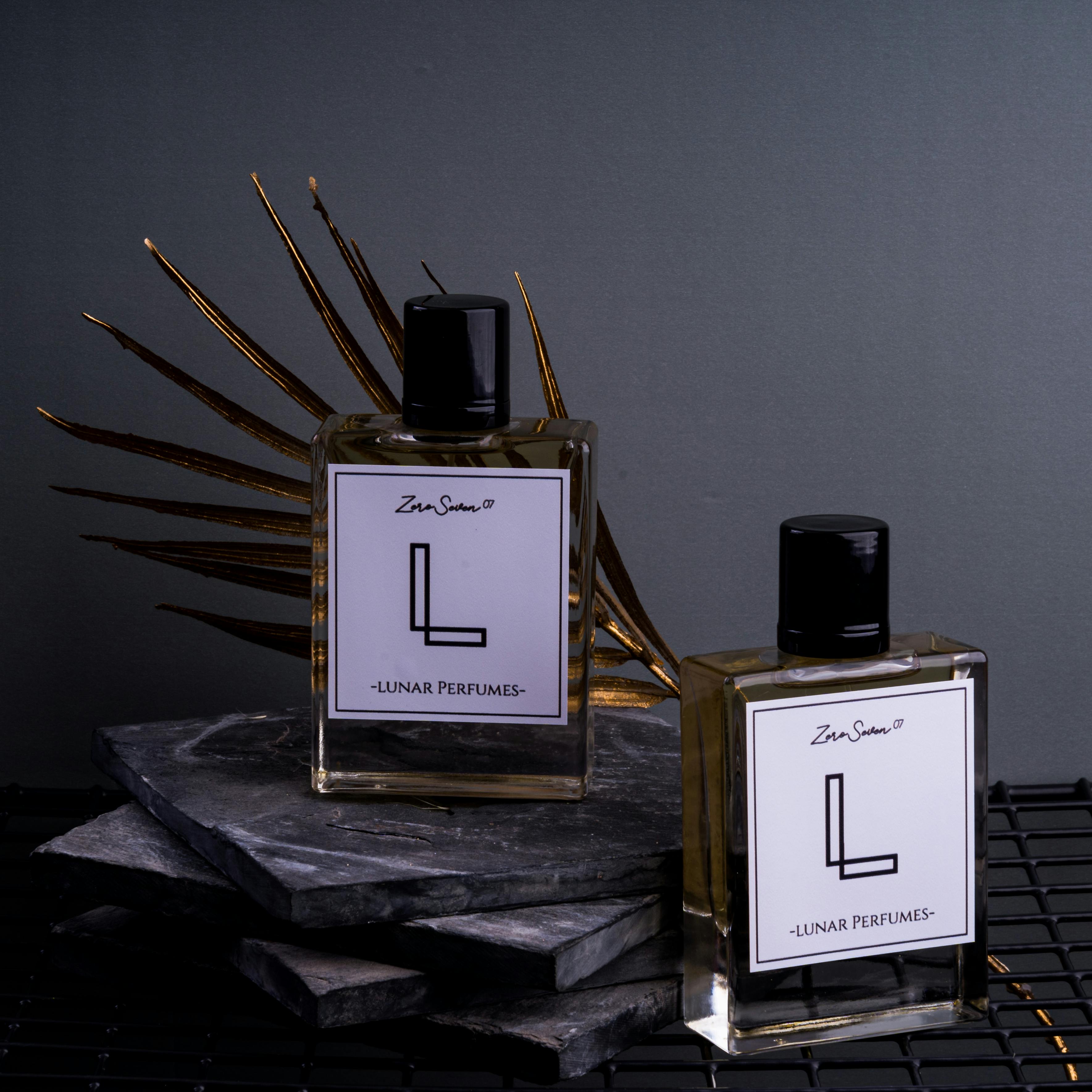 Product photography of perfume bottles on a grey background