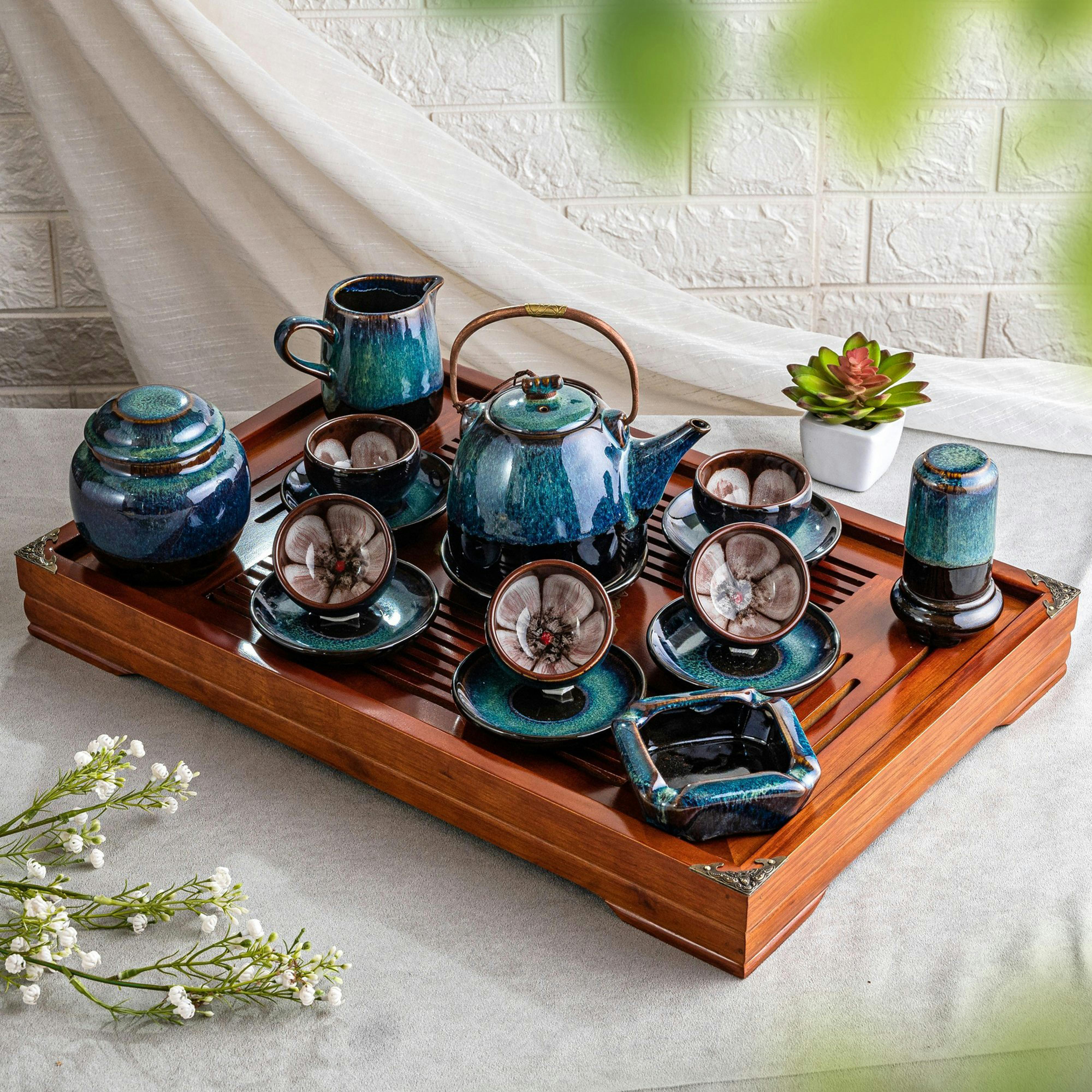 Product image of a ceramic tea set standing on a wooden tray